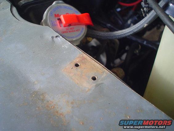 radiator cap and some engine parts in a vehicle