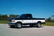 1995 Ford F-150 - This 1995 Ford F-150 pickup truck is shown from the front three-quarter view.