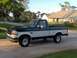 1995 Ford F-150 - Side view of a 1995 Ford F-150 pickup truck with a two-tone paint scheme.