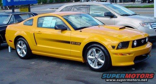 Yellow Ford Mustang GT/CS parked next to a silver SUV