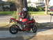2007 Yamaha R1 - Rider poses with a red 2007 Yamaha R1 motorcycle on a sunny day.