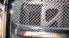 2004 Dodge Durango - Close-up of the front grille on a 2004 Dodge Durango, showing chrome accents and diamond pattern mesh.