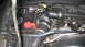 2004 Dodge Durango - Close-up of a Dodge Hemi 5.7L V8 engine bay, showing the battery and air intake.
