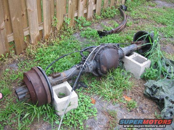 Ford rear axle assembly with leaf spring, resting on cinder blocks