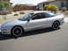1997 Ford Probe - Silver 1997 Ford Probe coupe with aftermarket wheels parked in a residential driveway.