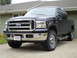1994 Ford F-250 - This Ford truck has a prominent chrome grille and a Wisconsin license plate.
