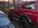 1994 Ford Bronco - This 1994 Ford Bronco is seen from the side, its distinctive fender flares and a sun graphic on the rear window.