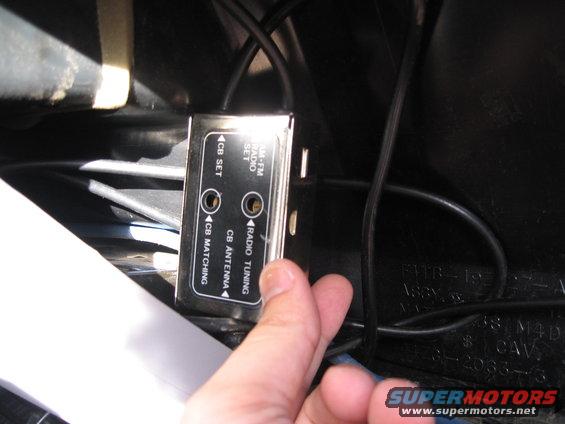 Close-up of a CB radio antenna matching unit with labels for CB SET, AM-FM RADIO SET, CB MATCHING, and RADIO TUNING