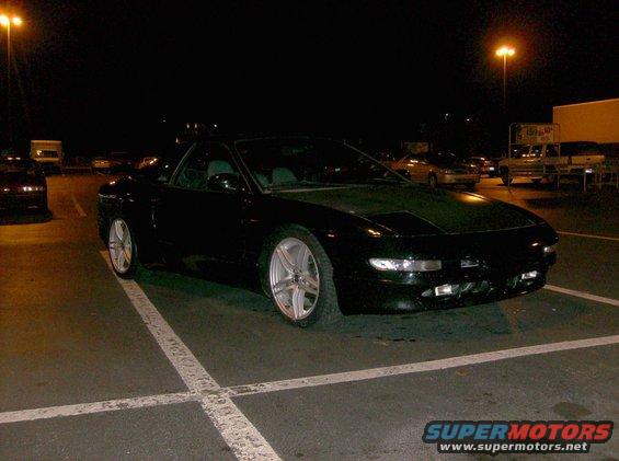 Black 1995 Ford Probe GT parked at night