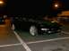 1995 Ford Probe - A black 1995 Ford Probe GT is parked in a lot at night, with aftermarket wheels visible.