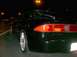 1995 Ford Probe - Rear view of a black 1995 Ford Probe GT parked at night, with visible "24 DOHC" badging.