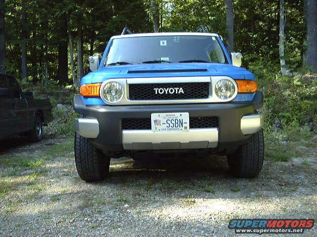 Blue 2007 Toyota FJ Cruiser parked in a wooded area