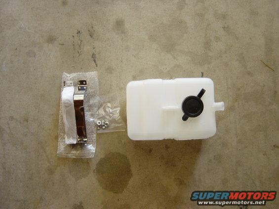 New plastic windshield washer fluid reservoir with black cap and assorted nuts and bolts in plastic bags