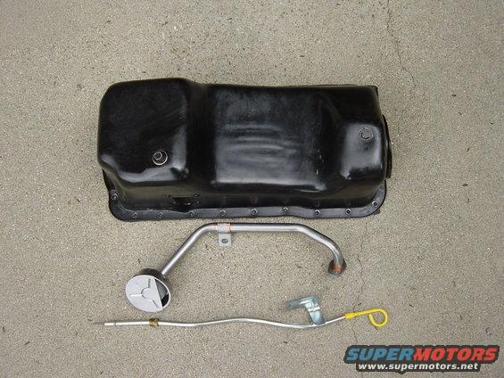 Oil pan and dipstick assembly on concrete