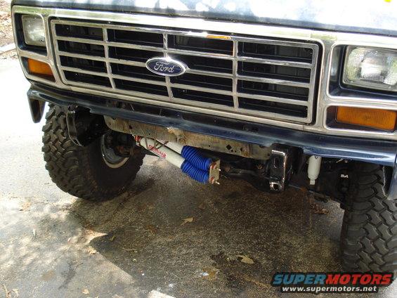 Front view of a 1984 Ford Bronco with aftermarket shocks visible below the bumper