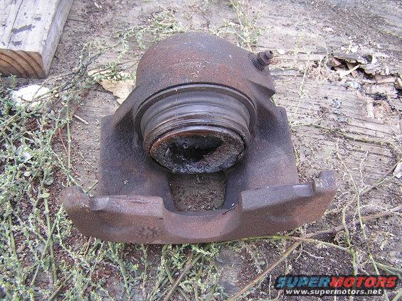 caliper.jpg Phenolic Piston, not good lookin'