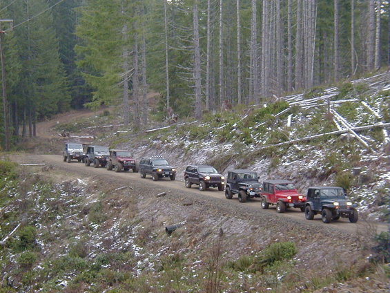 In front Larry with his nice YJ and Richard co-pilot. Good job guys on the trails too. Followed by John in his nice red YJ as well. He takes his rig too the max.. :-)