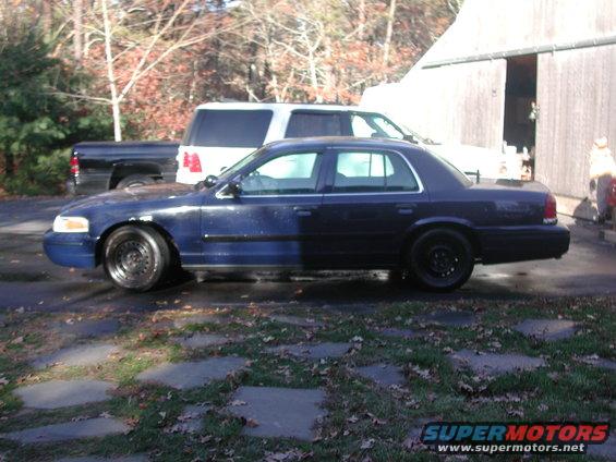 Dark blue 1998 Ford Crown Victoria sedan, side view