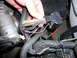 1996 Ford Probe - Disconnecting a complex wiring harness connector in the engine compartment.