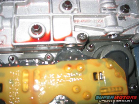 Transmission valve body with red fluid and yellow circuit board
