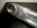 1996 Ford Bronco - A close-up view of a metal part, likely from a vehicle's suspension system, showing extensive welding.