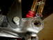 1996 Ford Bronco - A detailed view of a vehicle's suspension part, showing welds and attached components.