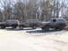 1979 Ford Bronco - Three SUVs, likely Ford Broncos, are parked together after an off-road excursion.