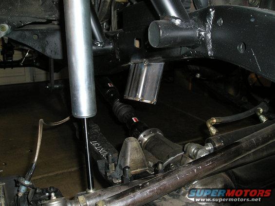 close-up of custom suspension parts, including a shock absorber and driveshaft