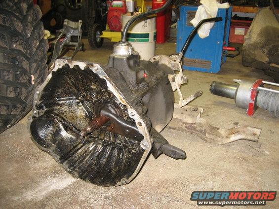 Greasy transmission and large tire in a workshop