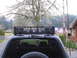 1990 Toyota 4Runner - SUV with roof rack and auxiliary lights parked outdoors. A spare tire is mounted on the rear.