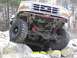 1996 Ford Bronco - This modified Ford Bronco is navigating a rocky trail, its off-road capabilities.