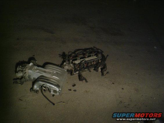 Engine intake manifold and cylinder head assembly on the ground