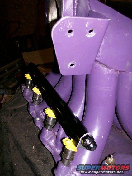 Purple intake manifold with black fuel rail and yellow injectors