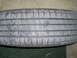 1994 Ford F-250 - A close-up view of a tire tread, showing wear patterns and markings.