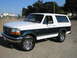 1995 Ford Bronco - This two-tone 1995 Ford Bronco is captured in a 3/4 front view, its classic SUV design.