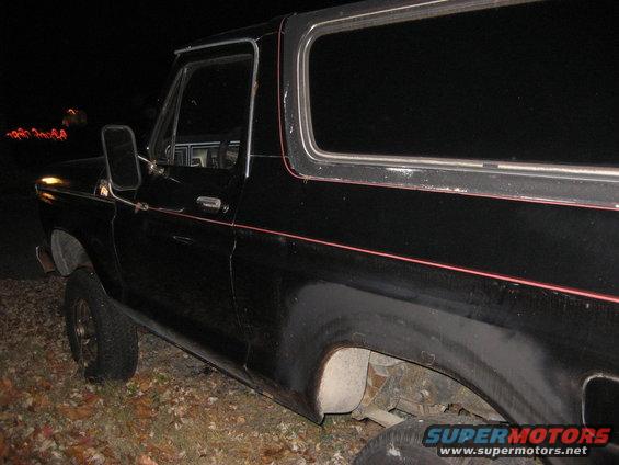 Black Ford Bronco side view at night