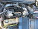 2001 Ford F-250 - A laptop is placed over the engine bay, likely for diagnostics or tuning.