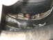 2001 Ford F-250 - This image shows a close-up of a dirty automotive part, likely from a vehicle's drivetrain or wheel assembly.