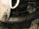 2001 Ford F-250 - This image shows a close-up view of engine components, including hoses and a pulley, with visible wear and tear.