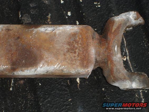 Rusted metal part with a U-shaped end