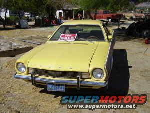 Yellow 1970 Ford Ranchero front 3/4 view with "FOR SALE" sign