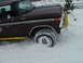 1979 Ford Bronco - Ford Bronco with plow attachment navigates through heavy snow.