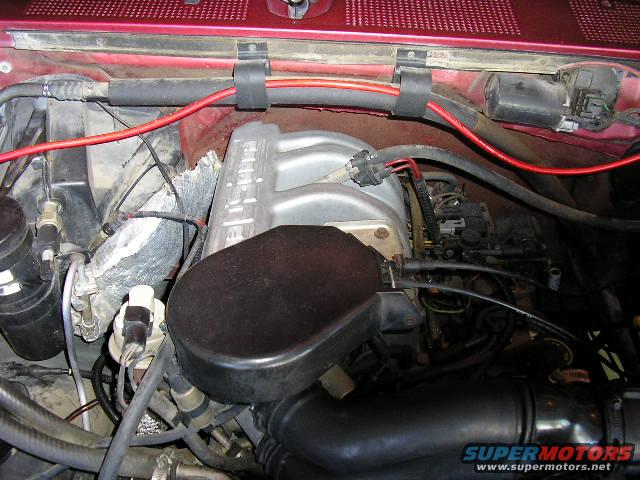 Engine bay with intake manifold and wiring