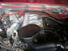 1994 Ford Bronco - Close-up view of an engine bay, showing the intake manifold and various hoses and wires.
