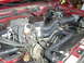 1994 Ford Bronco - Close-up view of an engine bay, showing various mechanical parts and wiring.