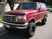 1994 Ford Bronco - This lifted 1994 Ford Bronco is shown from a three-quarter front view on a sunny day.