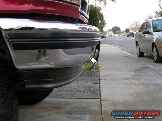 Red truck front bumper with chrome and tow hook