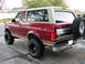 1994 Ford Bronco - This lifted Ford Bronco has a two-tone paint job and an external spare tire carrier.