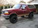 1994 Ford Bronco - This maroon Ford Bronco features a tan two-tone paint scheme and appears to be a 1992 model year.