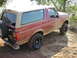 1994 Ford Bronco - This 1994 Ford Bronco is covered in mud after driving on a dirt path.
